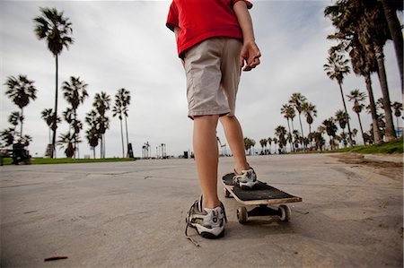 Boy riding on skateboard in park Stock Photo - Premium Royalty-Free, Code: 614-06625248