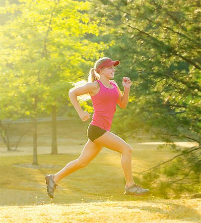 Teenage girl running in field Stock Photo - Premium Royalty-Free, Code: 614-06625280