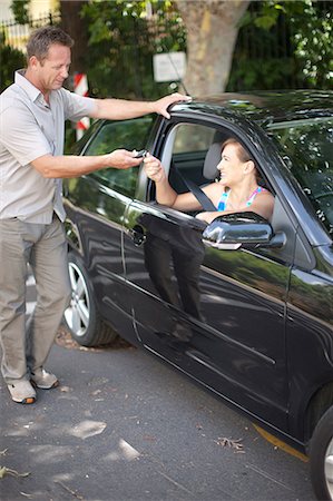 simsearch:614-06623416,k - Father giving teenage daughter car keys Stock Photo - Premium Royalty-Free, Code: 614-06623424