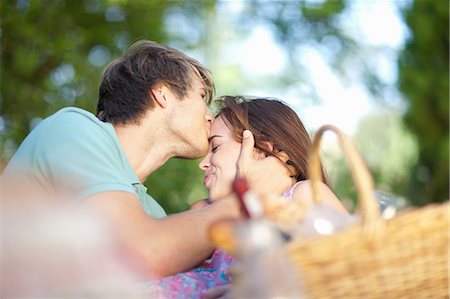 simsearch:614-06896801,k - Couple kissing in park Stock Photo - Premium Royalty-Free, Code: 614-06623549