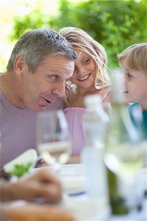 simsearch:614-06623604,k - Father and son talking at table outdoors Stock Photo - Premium Royalty-Free, Code: 614-06623614