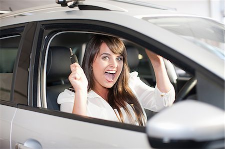 energy consumption - Cheering woman buying new car Photographie de stock - Premium Libres de Droits, Code: 614-06623962