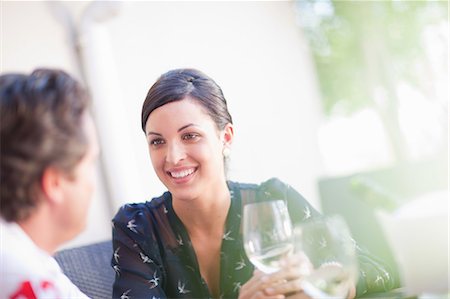 Couple having drinks together outdoors Stock Photo - Premium Royalty-Free, Code: 614-06623981