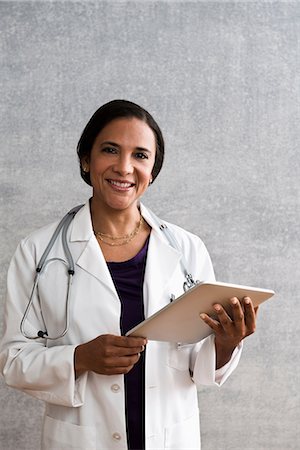 female doctors portraits - Portrait of a female doctor with digital tablet Stock Photo - Premium Royalty-Free, Code: 614-06718069