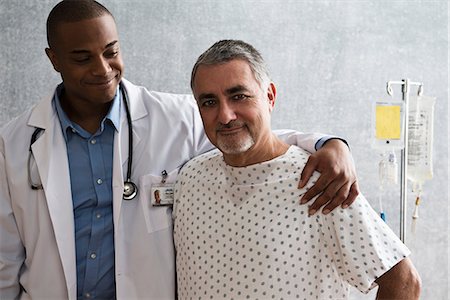 doctor and patient ethnic - Doctor supporting patient Stock Photo - Premium Royalty-Free, Code: 614-06718061