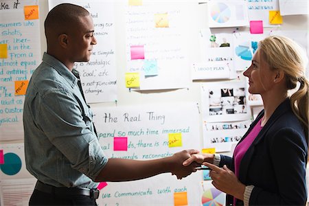 Colleagues shaking hands Stock Photo - Premium Royalty-Free, Code: 614-06718086