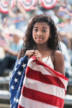 Girl at rally wrapped in american flag Photographie de stock - Premium Libres de Droits, Code: 614-06718159