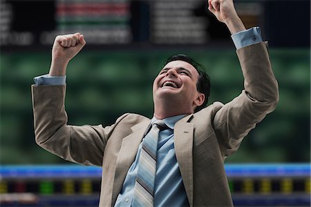 Happy businessman at stock exchange Stock Photo - Premium Royalty-Free, Code: 614-06718150