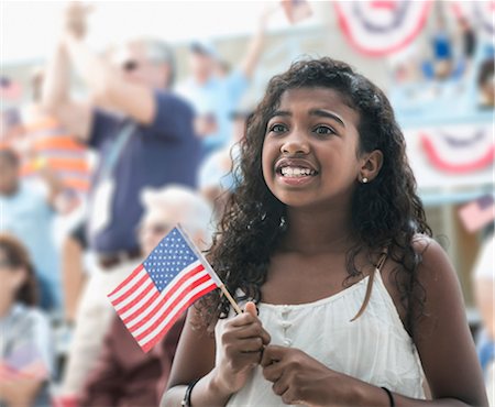 Girl holding american flag, looking anxious Photographie de stock - Premium Libres de Droits, Code: 614-06718163