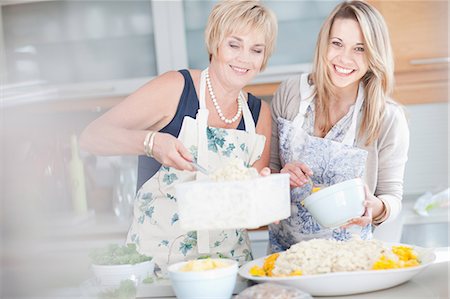 Mother and daughter cooking in kitchen Stock Photo - Premium Royalty-Free, Code: 614-06718807