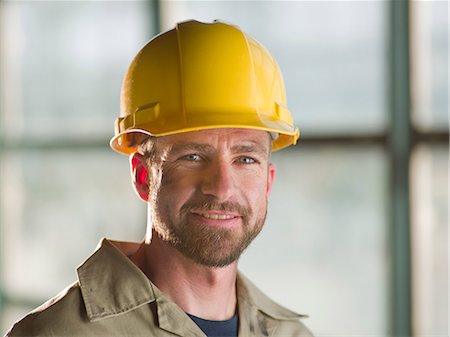 Engineer wearing hard hat on site Stock Photo - Premium Royalty-Free, Code: 614-06718849