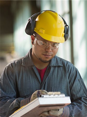 Engineer making notes on site Stock Photo - Premium Royalty-Free, Code: 614-06718852