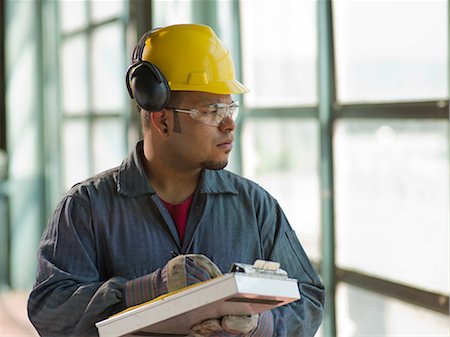 Engineer making notes on site Stock Photo - Premium Royalty-Free, Code: 614-06718853