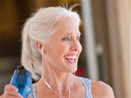 Older woman working out at home Stock Photo - Premium Royalty-Free, Code: 614-06718874