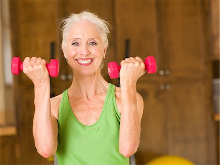 fitness   mature woman - Older woman lifting weights at home Stock Photo - Premium Royalty-Free, Code: 614-06718870