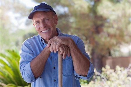 Older man gardening outdoors Stock Photo - Premium Royalty-Free, Code: 614-06718980