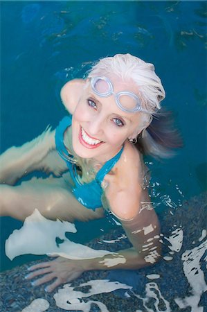 swimwear for mature women - Older woman swimming in pool Stock Photo - Premium Royalty-Free, Code: 614-06719049