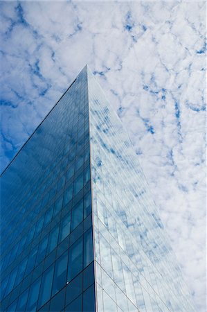 simsearch:6113-06721389,k - Glass skyscraper and cloudy sky Stock Photo - Premium Royalty-Free, Code: 614-06719111