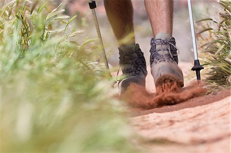 front of hiker - Hiker walking on dirt path Stock Photo - Premium Royalty-Free, Code: 614-06719144