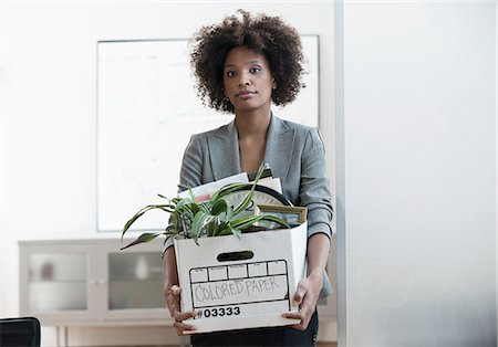 person with boxes - Businesswoman packing up box in office Stock Photo - Premium Royalty-Free, Code: 614-06719449