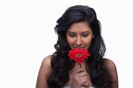 simsearch:614-06814236,k - Young woman with red flower Stock Photo - Premium Royalty-Free, Code: 614-06814191