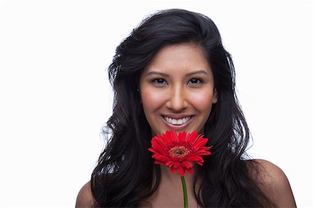 simsearch:614-06814236,k - Young woman with red flower Stock Photo - Premium Royalty-Free, Code: 614-06814192