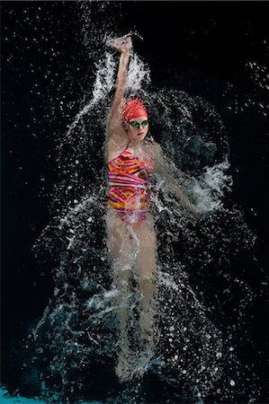 swimsuit sport - Teenage girl doing backstroke in swimming pool Stock Photo - Premium Royalty-Free, Code: 614-06814269