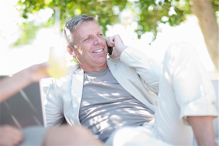 Mature man on cell phone Stock Photo - Premium Royalty-Free, Code: 614-06813985