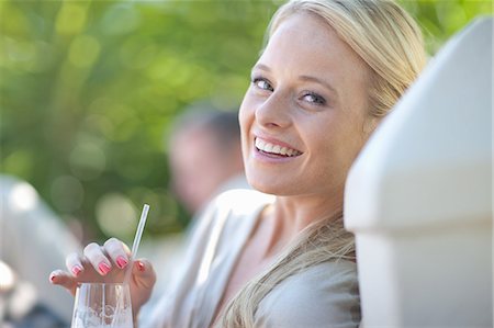Young woman with drink Stock Photo - Premium Royalty-Free, Code: 614-06813983