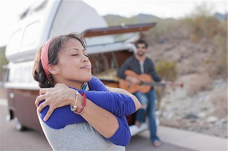 Young woman dancing on road Stock Photo - Premium Royalty-Free, Code: 614-06896167