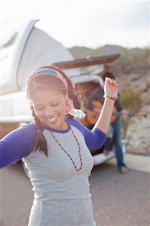 Young woman dancing on road Stock Photo - Premium Royalty-Free, Code: 614-06896168