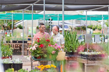 Mature man and mid adult woman shopping in garden centre Stock Photo - Premium Royalty-Free, Code: 614-06896299