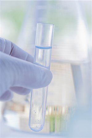 Scientist holding test tube Stock Photo - Premium Royalty-Free, Code: 614-06896643