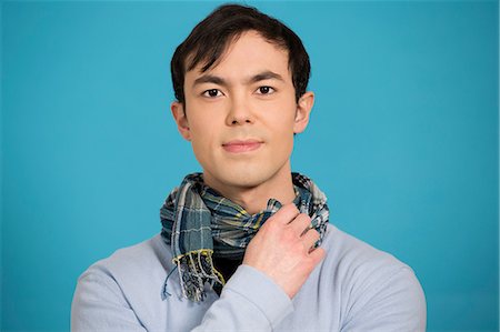 simsearch:614-06896861,k - Portrait of young man wearing blue jumper and scarf Stock Photo - Premium Royalty-Free, Code: 614-06896856