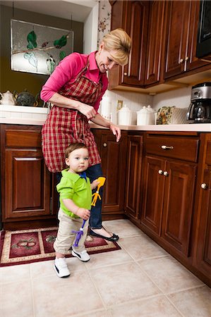 Young male toddler and grandmother in kitchen Stock Photo - Premium Royalty-Free, Code: 614-06897446