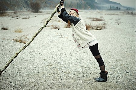 Woman holding log Stock Photo - Premium Royalty-Free, Code: 614-06897520