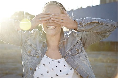 Woman covering eyes Stock Photo - Premium Royalty-Free, Code: 614-06897537