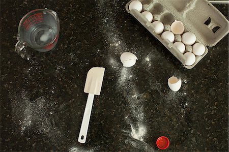 flour - Kitchen counter with egg box, jog and spatula Stock Photo - Premium Royalty-Free, Code: 614-06897665