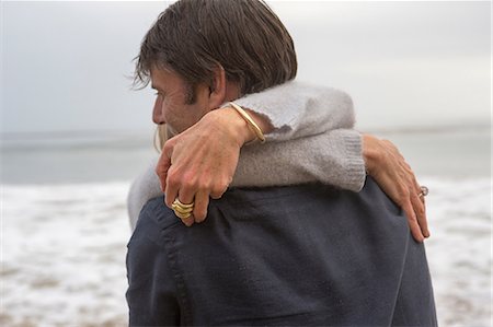 simsearch:614-06897731,k - Mature couple embracing on beach Stock Photo - Premium Royalty-Free, Code: 614-06897725