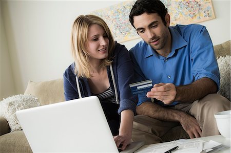 debit card - Young couple shopping online with credit card Stock Photo - Premium Royalty-Free, Code: 614-06897767