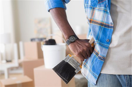 renovations man - Close-up of man holding paintbrush Stock Photo - Premium Royalty-Free, Code: 614-06897975