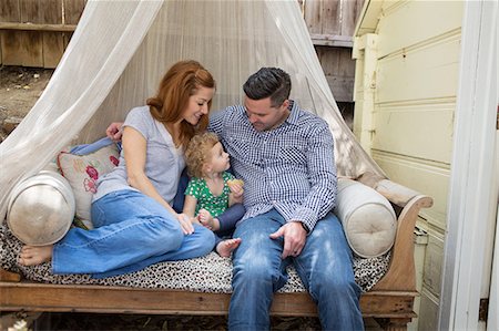 family gardening - Couple on daybed with child Stock Photo - Premium Royalty-Free, Code: 614-06898412