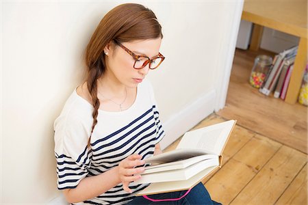 Woman reading book Stock Photo - Premium Royalty-Free, Code: 614-06898537