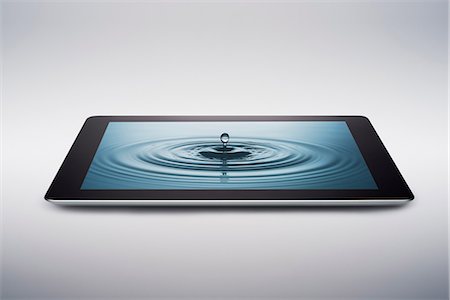 Digital tablet with water drop on screen Photographie de stock - Premium Libres de Droits, Code: 614-06974072