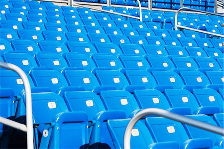 Empty blue seating in sports stadium Stock Photo - Premium Royalty-Free, Code: 614-06974101