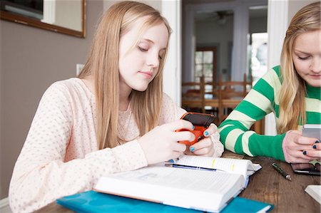 revising - Girls sitting at table studying Stock Photo - Premium Royalty-Free, Code: 614-06974345