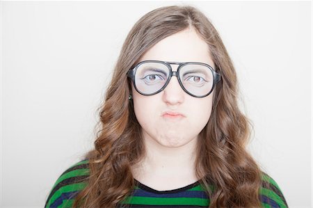 Girl wearing fake glasses Stock Photo - Premium Royalty-Free, Code: 614-06974350