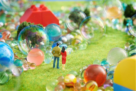 Figurines pretend grass with marbles Stock Photo - Premium Royalty-Free, Code: 614-06974863