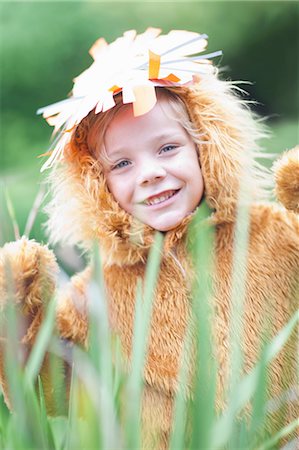 dressed up - Child wearing lion costume Stock Photo - Premium Royalty-Free, Code: 614-06973549