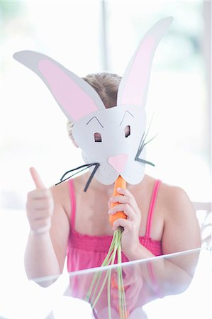energy consumption - Girl in rabbit costume eating carrot Photographie de stock - Premium Libres de Droits, Code: 614-06973553